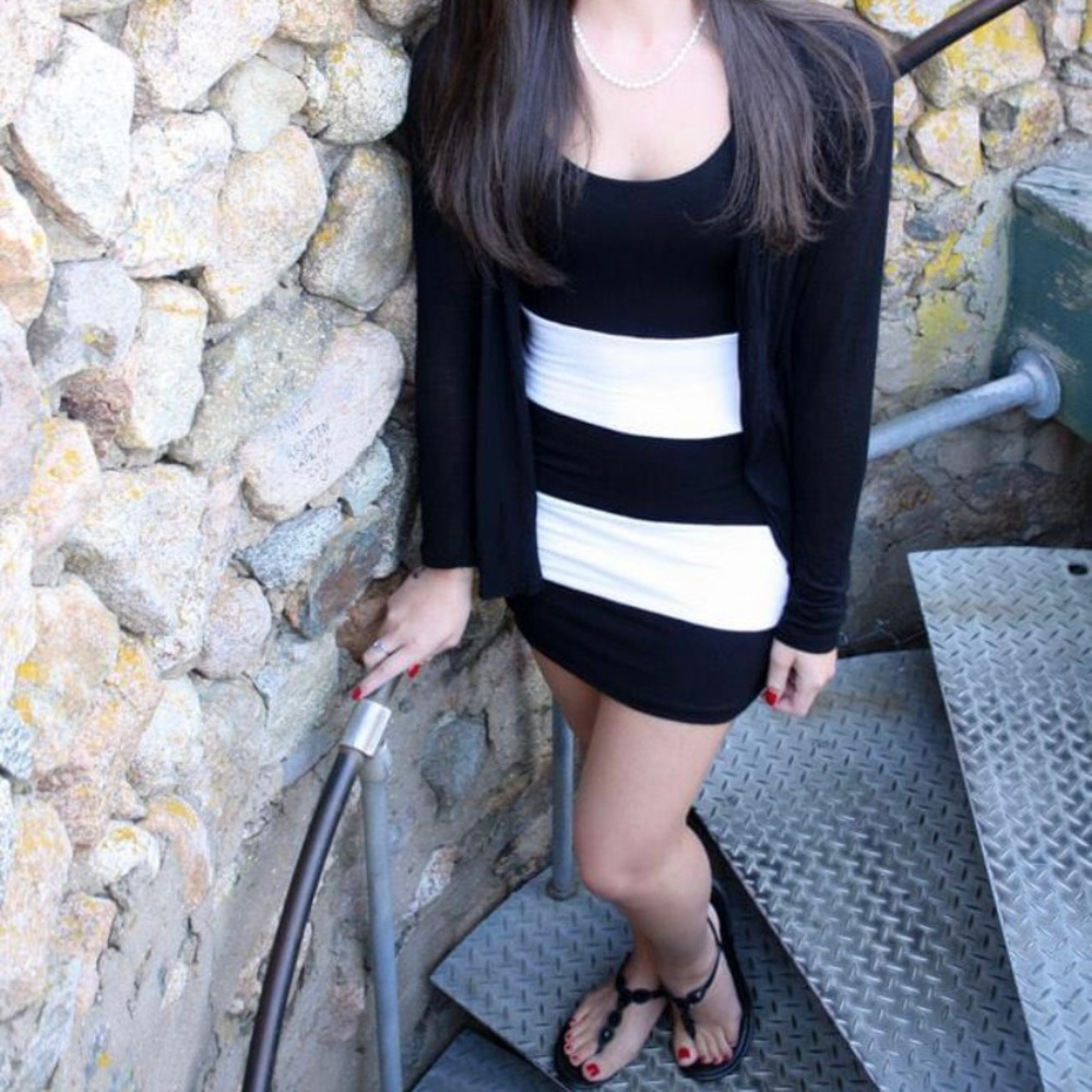 Black and white striped form fitting sleeveless dress. In great condition!